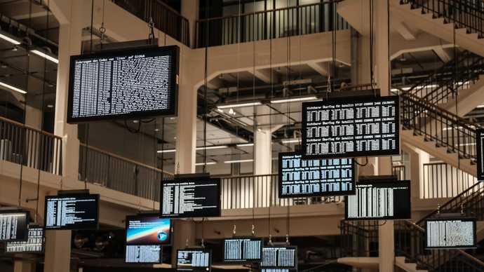 Digital sign boards displaying data hanging from the ceiling