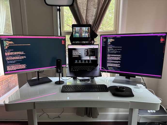 Photo of current work from home setup with new BenQ RD280U Programming monitor on right hand side