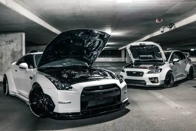 super fast Japanese cars with their hoods popped